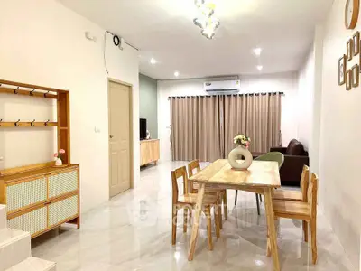 Modern living room with wooden dining set and cozy seating area