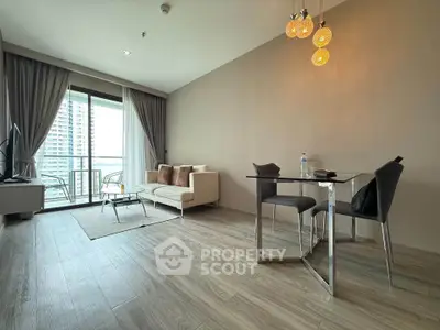 Modern living room with elegant decor and balcony view in a high-rise apartment.