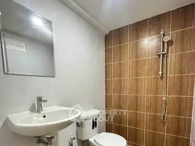 Modern bathroom with sleek fixtures and stylish tile design