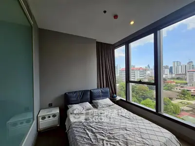 Modern bedroom with panoramic city view and stylish decor