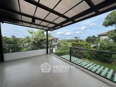 Spacious balcony with stunning garden and mountain views in a modern residential area.