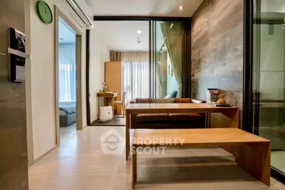 Modern living room with wooden furniture and glass partition