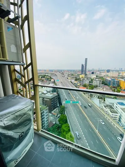 Stunning high-rise balcony view overlooking cityscape and highway, perfect for urban living enthusiasts.