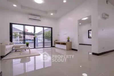 Spacious modern living room with large windows and sleek flooring