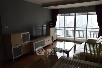 Spacious living room with city view and modern furniture in high-rise apartment