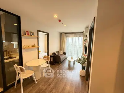 Modern living room with cozy seating and natural light in stylish apartment