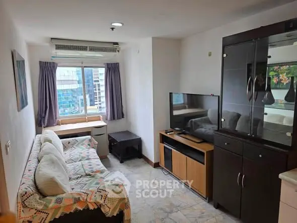 Cozy living room with modern furniture and city view, perfect for urban living.