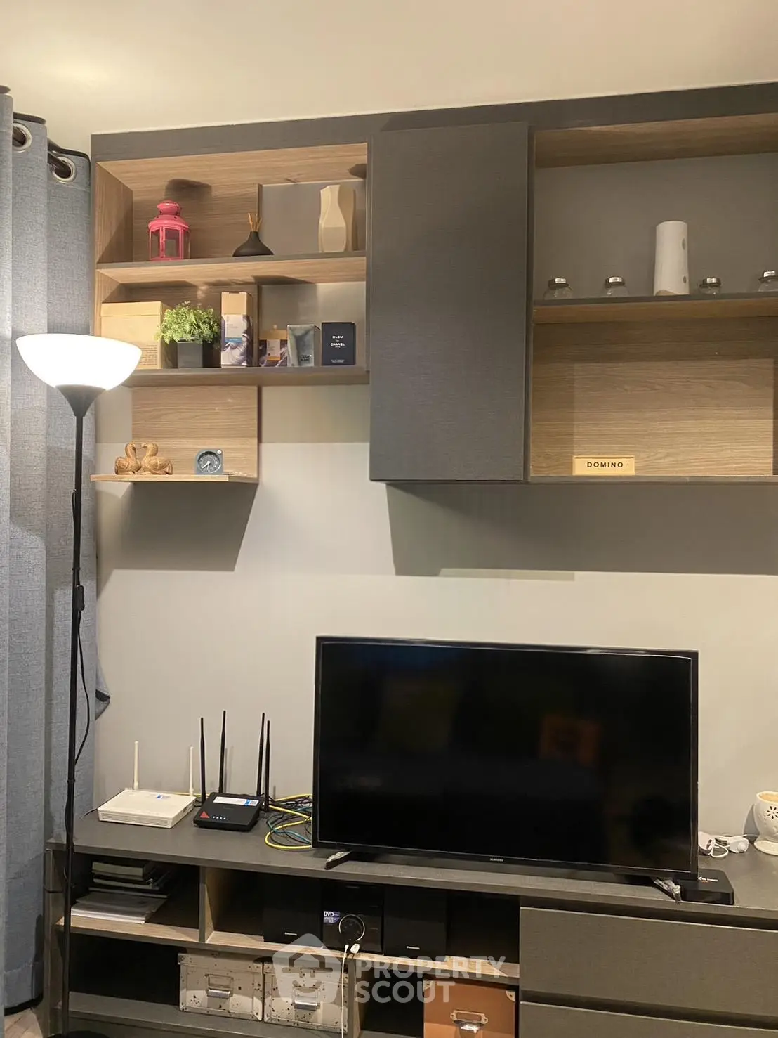 Modern living room with stylish shelving and entertainment setup
