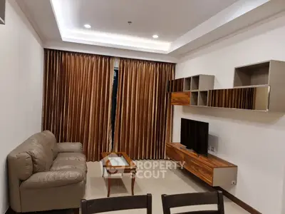 Modern living room with sleek furniture and elegant lighting