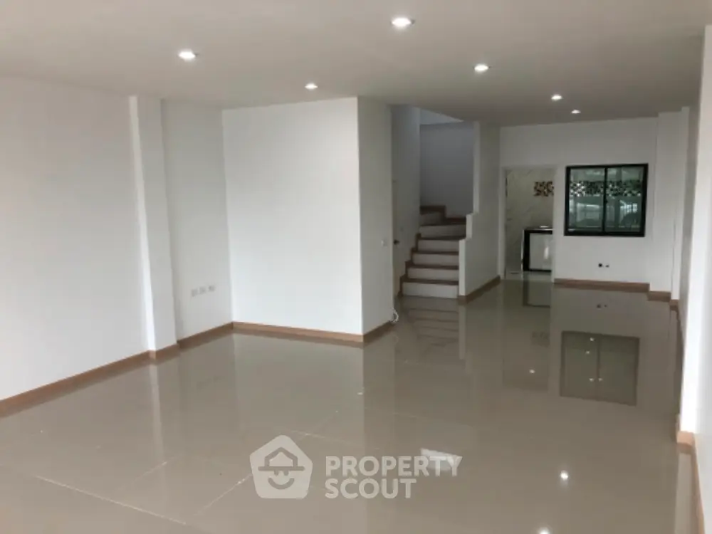 Spacious modern interior with glossy tiled floors and open layout, perfect for customization.