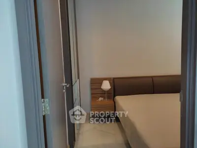 Cozy bedroom with modern furnishings and soft lighting, perfect for relaxation and comfort.