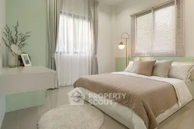 Cozy modern bedroom with stylish decor and natural light