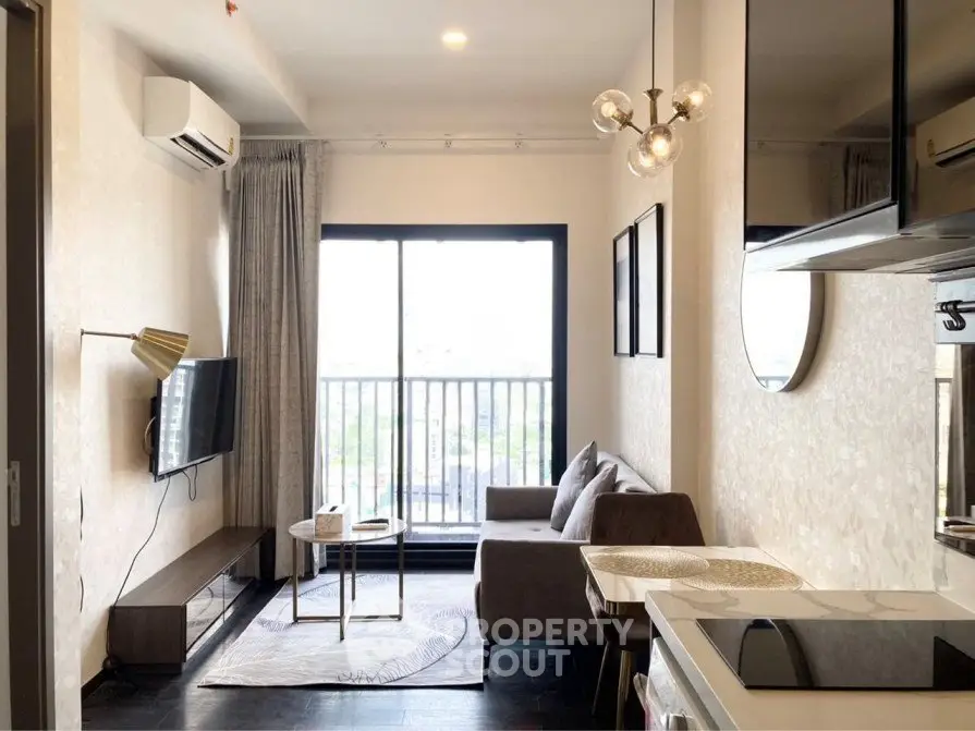 Modern living room with balcony view, stylish furniture, and elegant lighting in a cozy apartment.