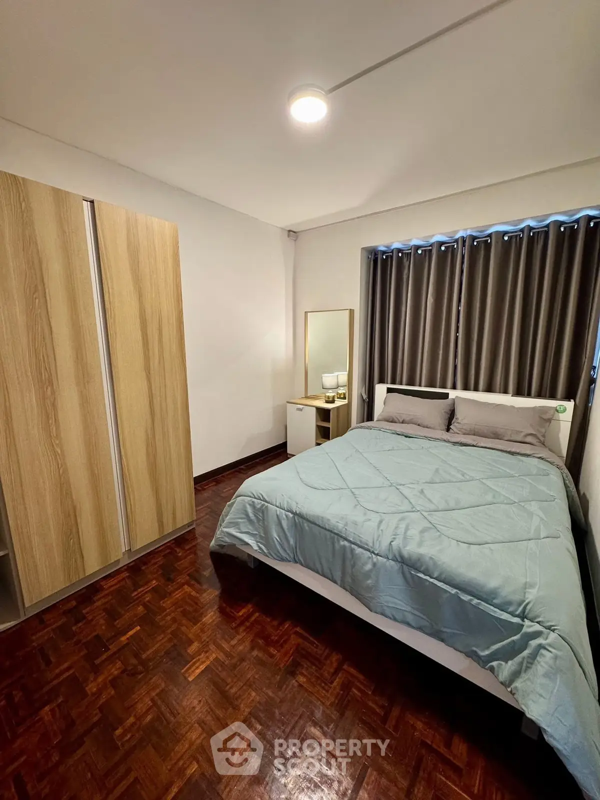 Cozy bedroom with modern decor and wooden flooring