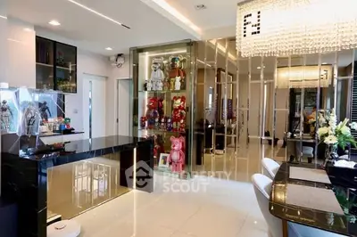 Luxurious modern living room with elegant decor and glass display cabinets