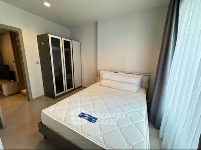 Modern bedroom with stylish wardrobe and cozy bed in a bright apartment