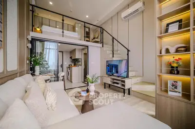 Luxurious modern living room with mezzanine, stylish decor, and open kitchen layout.