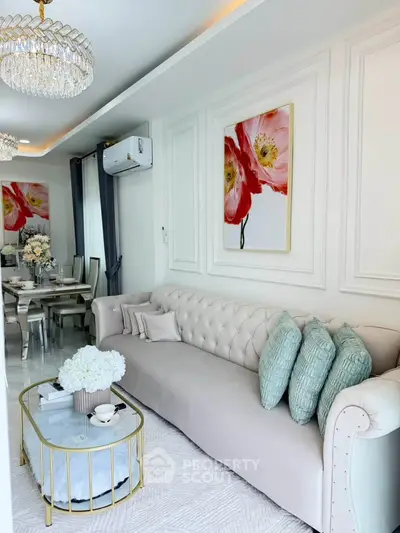Luxurious living room with elegant decor and plush seating in modern apartment.
