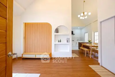 Spacious open-plan living area with modern kitchen and stylish decor