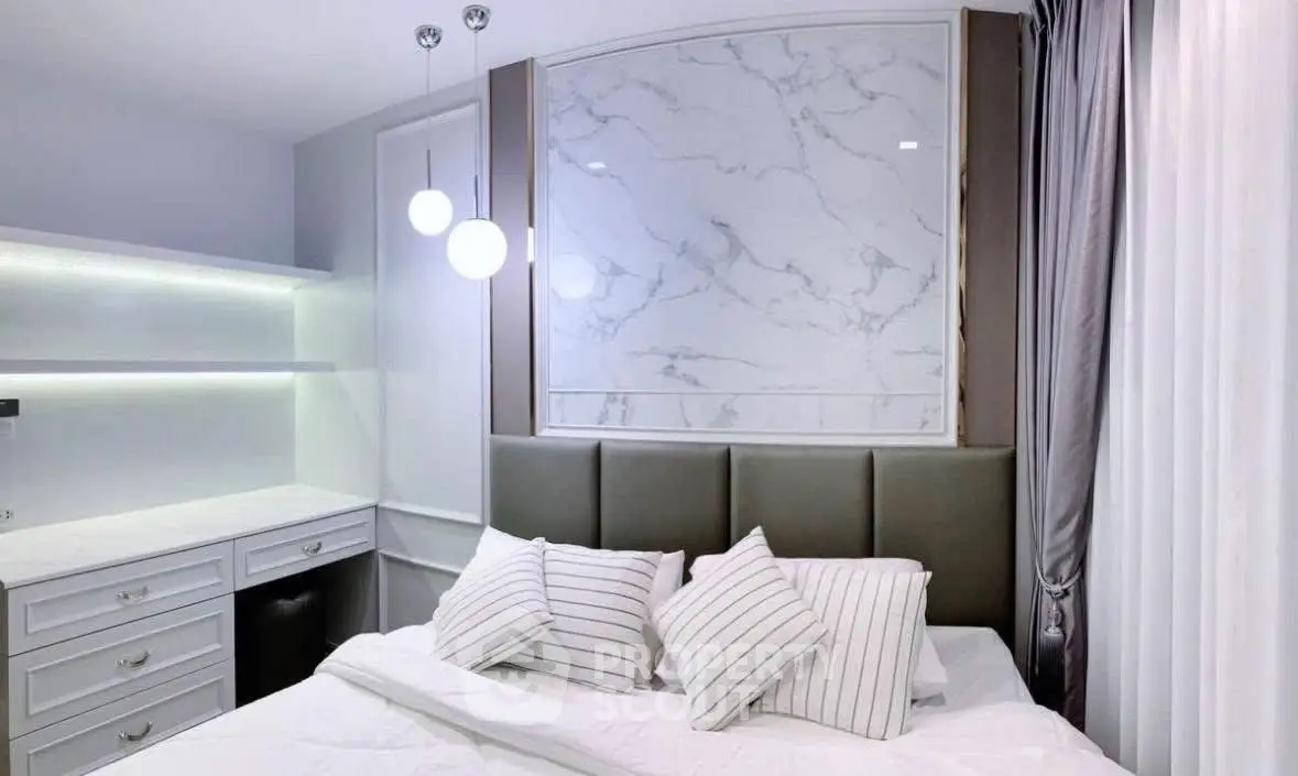 Modern bedroom with elegant marble accent wall and stylish lighting