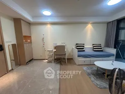 Modern living room with stylish furniture and cozy lighting, perfect for relaxation and entertainment.