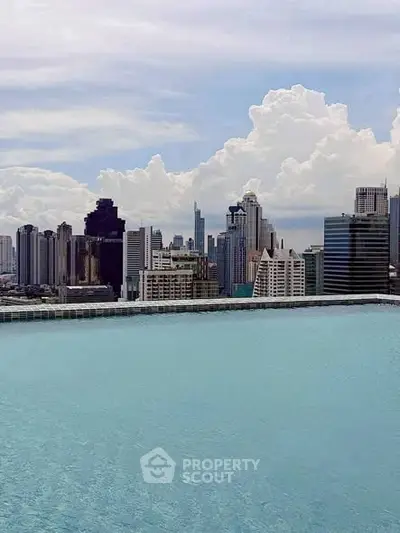 Stunning rooftop pool with breathtaking city skyline view, perfect for luxury urban living.