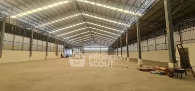 Spacious industrial warehouse with high ceilings and ample storage space.