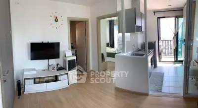 Modern apartment interior with open kitchen and balcony view