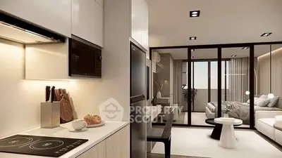 Modern open-plan kitchen and living room with sleek design and natural light.