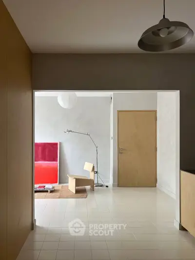 Minimalist interior with modern art and sleek furniture in a stylish living space.