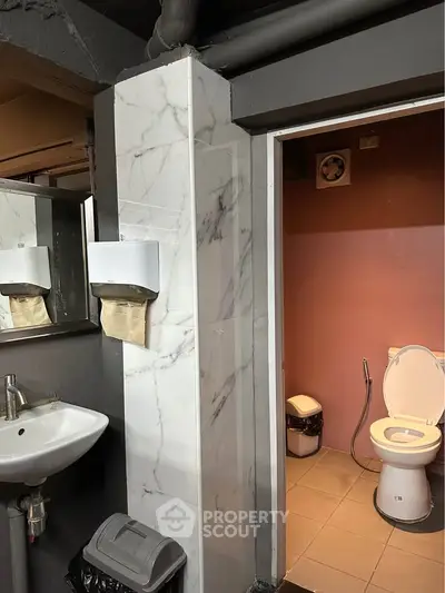 Modern bathroom with marble accents and sleek fixtures