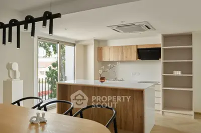 Modern kitchen with open layout and stylish wooden cabinetry
