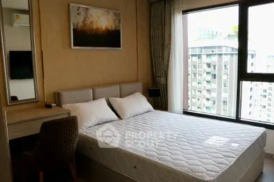 Modern bedroom with large window and city view in high-rise apartment