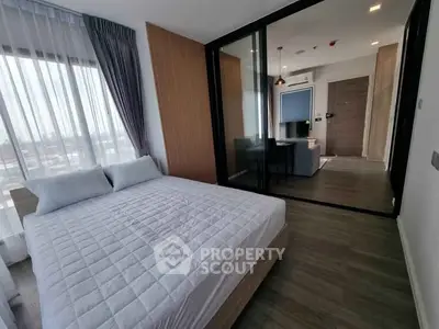 Modern bedroom with glass partition and stylish decor