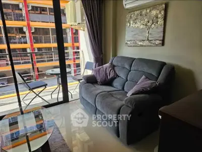 Cozy living room with balcony view and modern decor