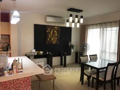 Stylish dining area with modern lighting and elegant decor in a contemporary apartment.