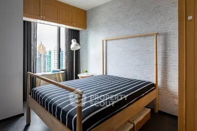 Modern bedroom with city view, stylish decor, and natural light.