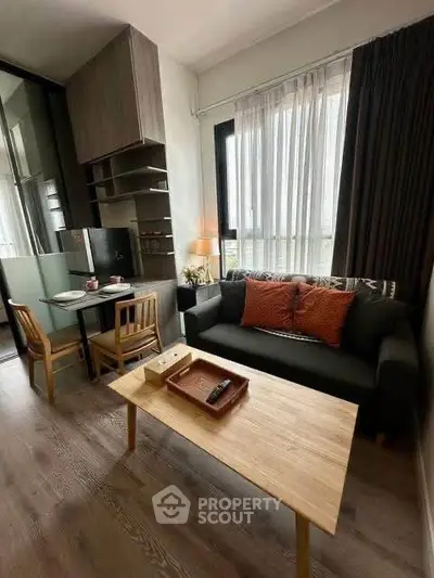 Modern living room with cozy sofa and dining area in stylish apartment