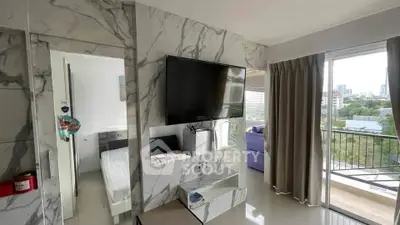 Modern apartment interior with marble accents and balcony view