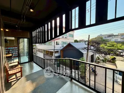 Modern balcony with urban view and stylish railing in contemporary building