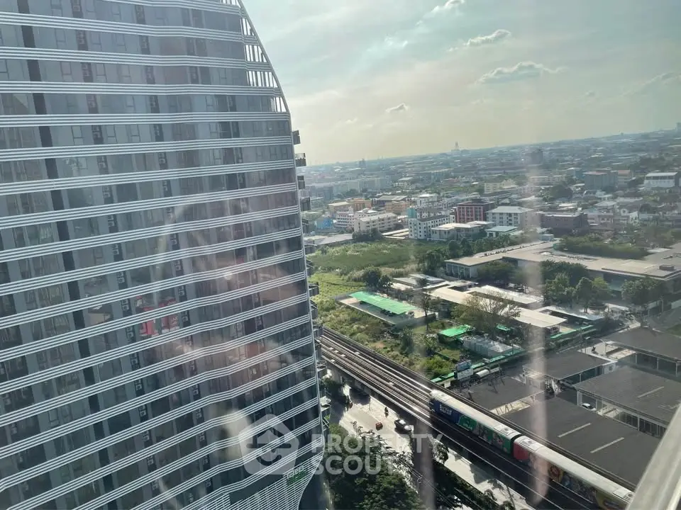 Stunning cityscape view from high-rise building with modern architecture and urban landscape.