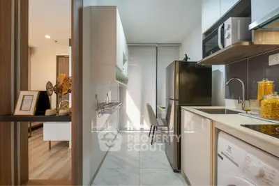 Modern kitchen with sleek appliances and open layout in stylish apartment