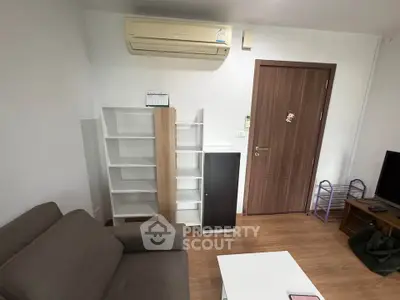 Cozy living room with air conditioning and modern furniture, perfect for relaxation.