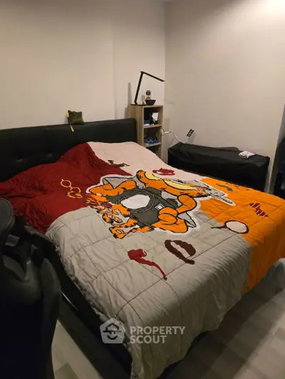 Cozy bedroom with unique character-themed bedding and modern decor