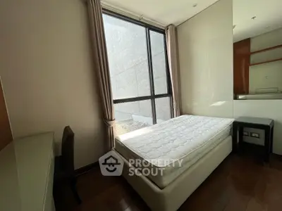 Cozy bedroom with natural light and modern furnishings