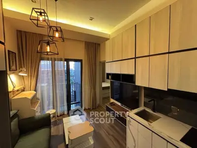 Modern living room with stylish lighting and balcony view in a cozy apartment.
