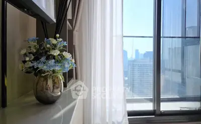 Bright modern living room with city view and elegant decor