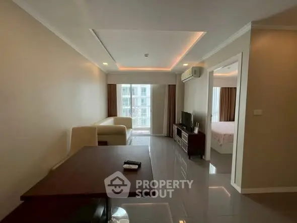 Spacious living room with modern decor and natural light