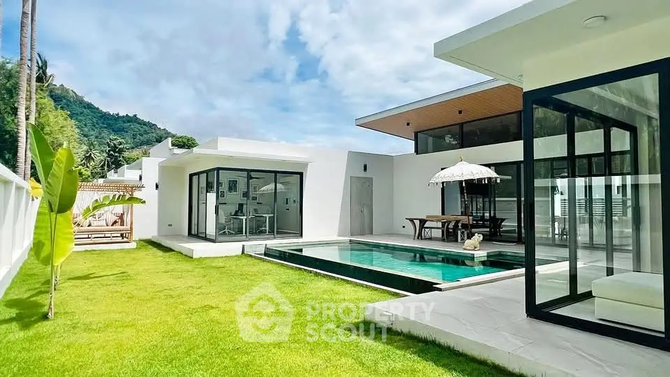 Luxurious modern villa with private pool and lush garden in tropical setting