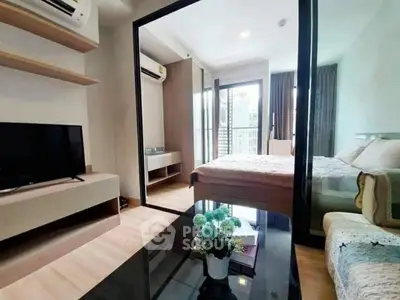 Modern bedroom with balcony view, stylish decor, and natural light